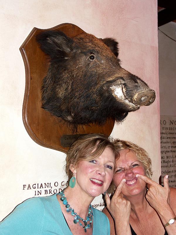 PICT0159.JPG - Two girls in front of boar's head at Trattoria Za-Za at Piazza Mercato Centrale Firenze