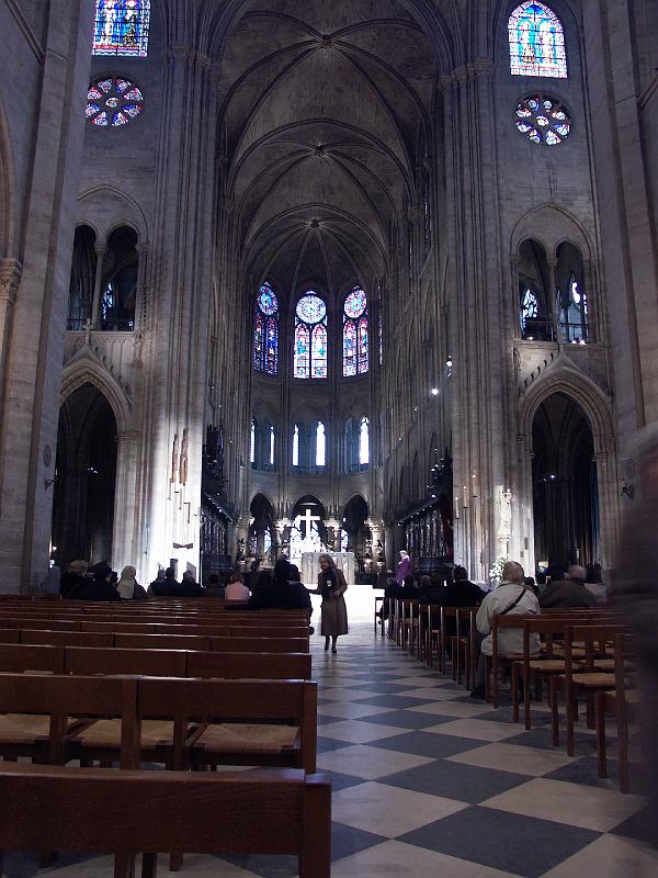 PICT3213.JPG - Woman taking collection inside Notre Dame during service