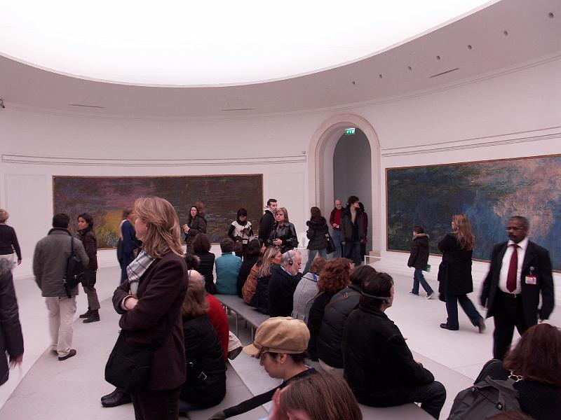 PICT3317.JPG - Overall panoramic view of how the paintings were displayed.  Known as the Nympheas, the series was painted in Monet's garden at Giverny, near Paris and presented to the public in 1927.